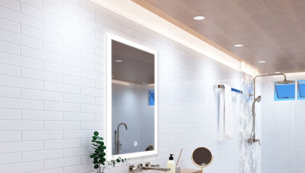 A bright modern bathroom with an LED bathroom mirror, strip lights lining the ceiling, and multiple LED downlights.