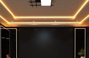 Creating Better Winter Lighting with Downlights, Lamps and LED Strips A living room ceiling with a statement centre light and warm strip lights along the ceiling coves.