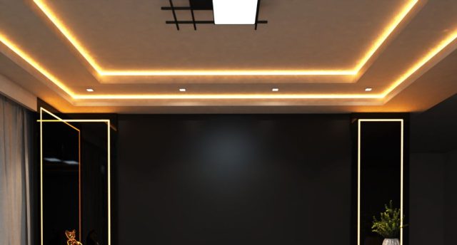 A living room ceiling with a statement centre light and warm strip lights along the ceiling coves.