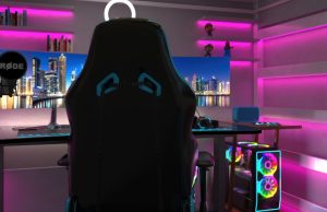 Gaming & Entertainment Room Lighting Ideas for Immersion A PC gaming setup with pink strip lights lining the walls and shelves.