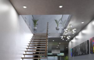 A modern home stairs with multiple LED downlights and pendants around the lower ground ceiling.