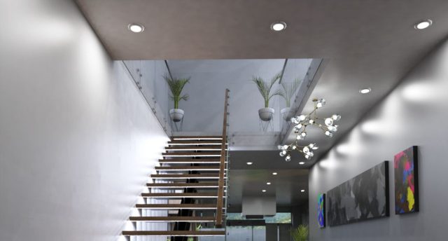 A modern home stairs with multiple LED downlights and pendants around the lower ground ceiling.