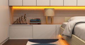 Yellow under cabinet strip light in a modern bedroom.