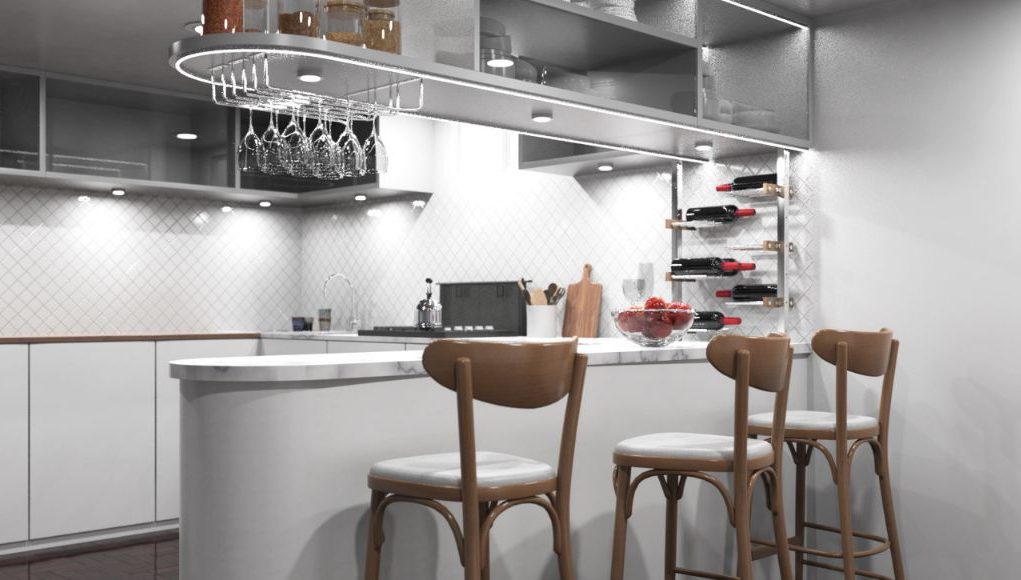 A modern kitchen with an island/bar area and bar stools, under-cabinet lights are illuminating the space.