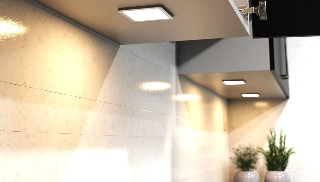 Square under cabinet lighting with a warm glow.