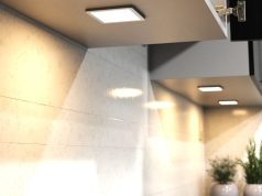 Square under cabinet lighting with a warm glow.