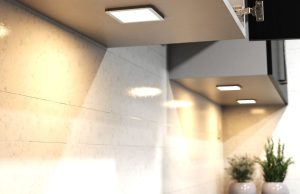 Square under cabinet lighting with a warm glow.