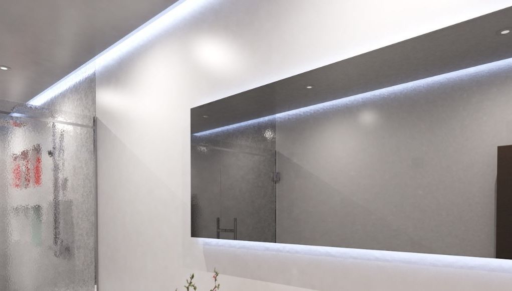 A bright modern bathroom with a large horizontal mirror and ceiling strip lighting.