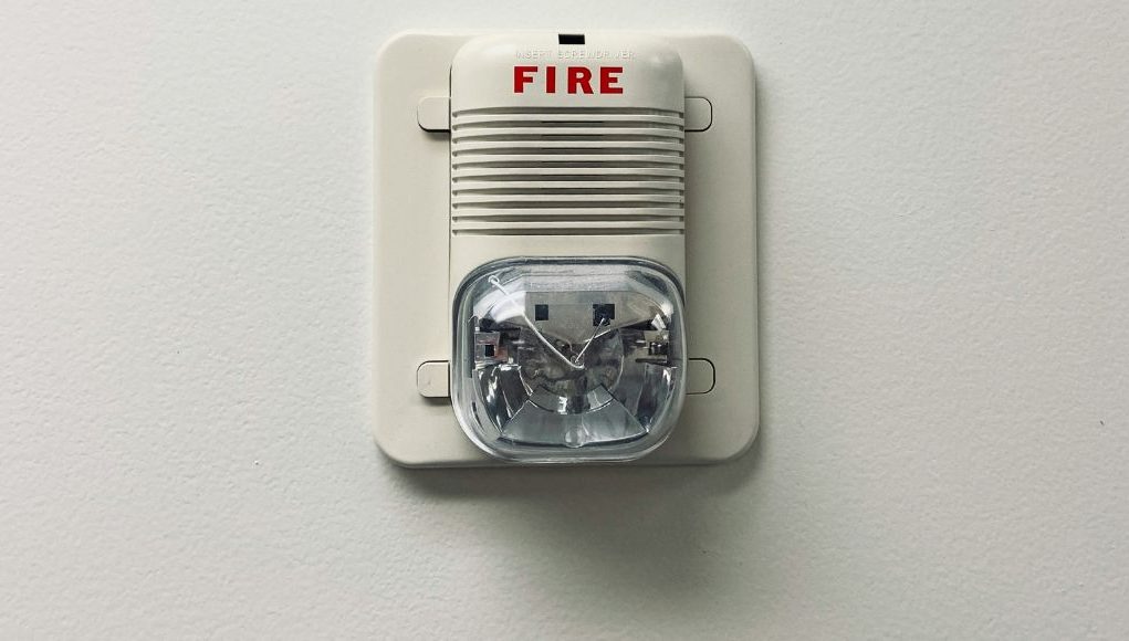A fire safety equipment installed on a white wall.