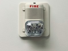 A fire safety equipment installed on a white wall.