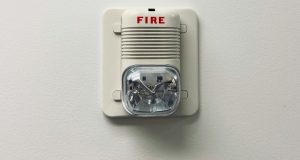 A fire safety equipment installed on a white wall.