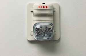 A fire safety equipment installed on a white wall.