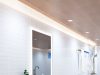 The Best Modern Lighting Upgrades for a Fresh Home Makeover in 2026 A bright bathroom with a wooden ceiling installed with LED downlights and warm LED strips around the perimeter.