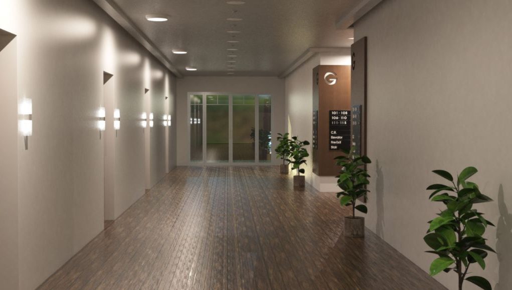 UK Emergency Lighting Regulations 2026 hero image A hotel hallway with multiple rooms illuminated by round bulkhead lights.