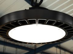 A high bay light with a warehouse background.