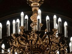 What Is the Brightest E14 LED Bulb? A chandelier with multiple natural white LED candle bulbs.