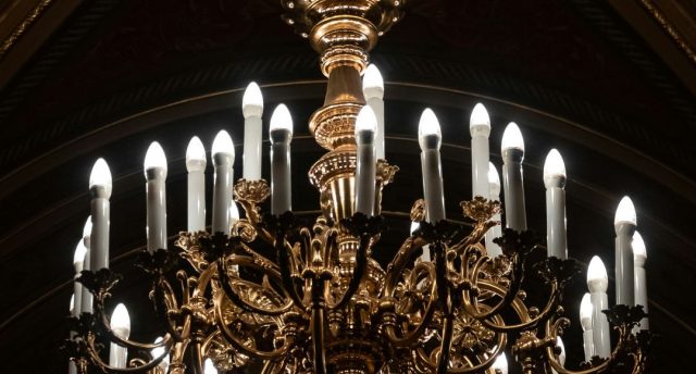 A chandelier with multiple natural white LED candle bulbs.