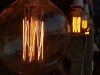 What Is the Brightest LED Filament Bulb? Multiple filament bulbs glowing with an amber hue.