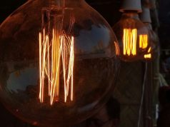 What Is the Brightest LED Filament Bulb? Multiple filament bulbs glowing with an amber hue.