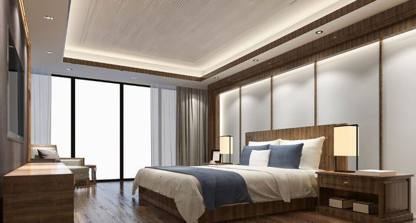 Bright, modern bedroom with LED strip lights installed inside the ceiling cove.