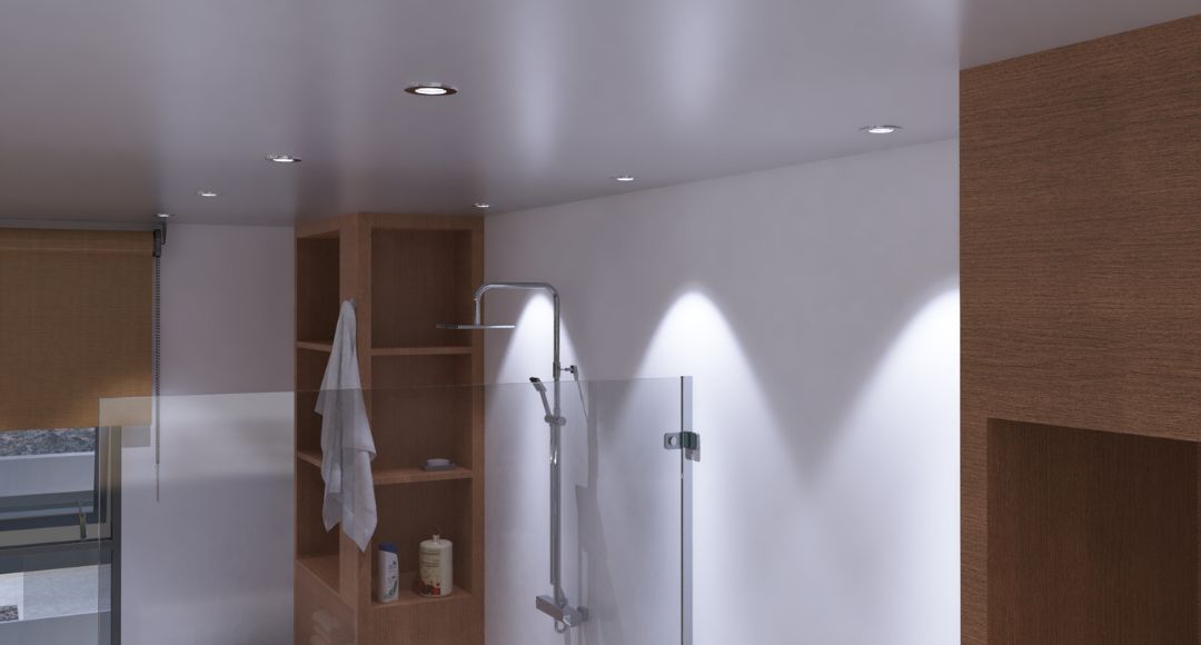 A modern bathroom illuminated by multiple LED downlights.