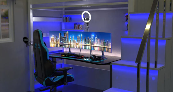 A gaming space with dual monitors and blue lighting around.