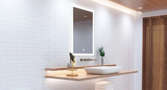 A bright modern bathroom with an LED mirror and warm accent lights.