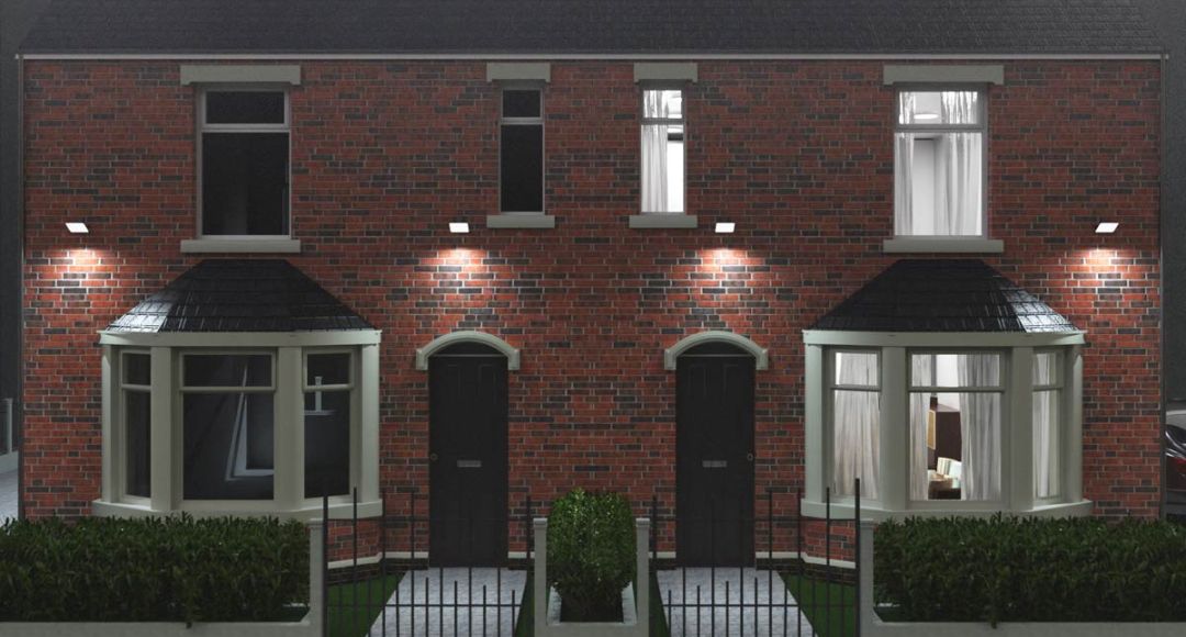 Front yard of a brick UK home with multiple floodlights installed.
