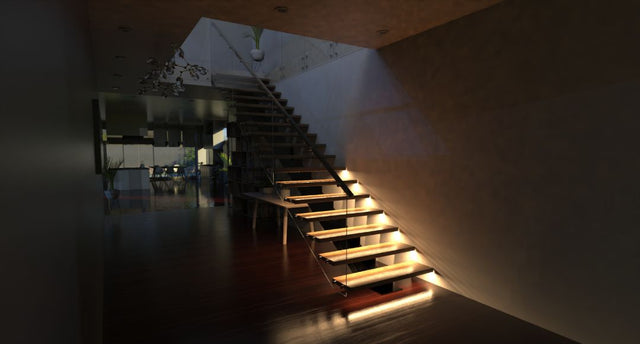 A modern staircase lit halfway.