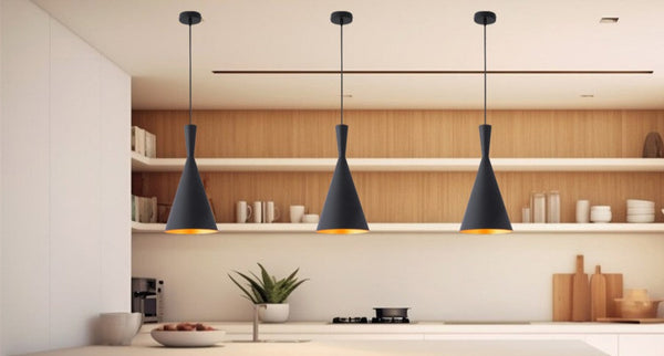 three black pendant lights installed in a kitchen