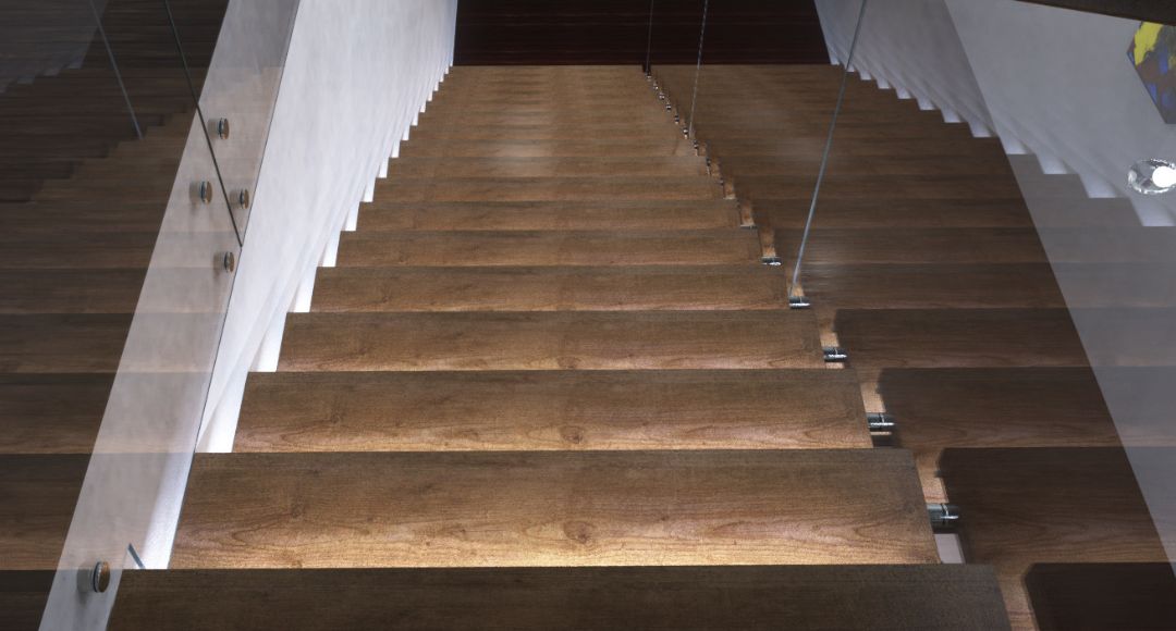 A top view of a wooden staircase inside a modern house with each step illuminated by LED lights.