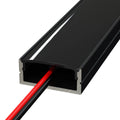 black surface-mounted LED profile with an LED strip