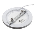 Back of Discus LED downlight showing the pre-wired cable and adjustable bracket with spring-loaded clips, white background.