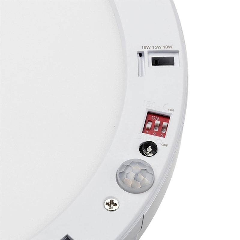 Downlight's bezel closeup that shows the sensor and different switches for power control and temperature.