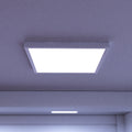 close up of an installed surface mounted panel light with cool white light