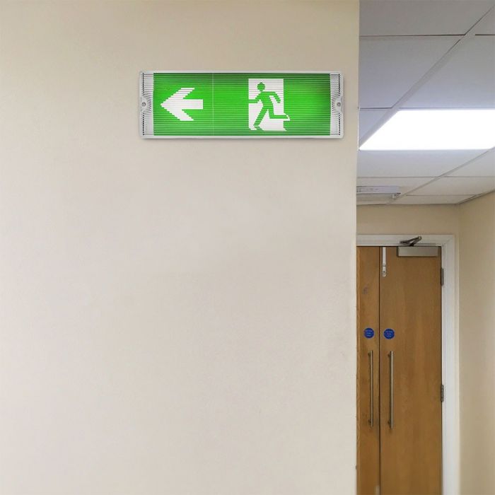 ExitGuardian - LED Exit Signage - Illuminated emergency exit sign in a hallway with arrow left label