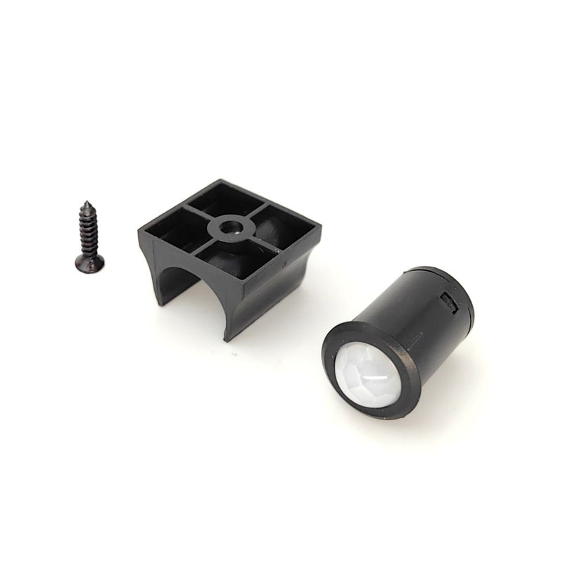 Simple Lighting - PIR Sensor - Sensor, bracket, and screw side by side on a white surface