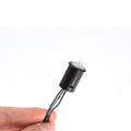 Simple Lighting - PIR Sensor - A hand holding a cable with an attached PIR sensor