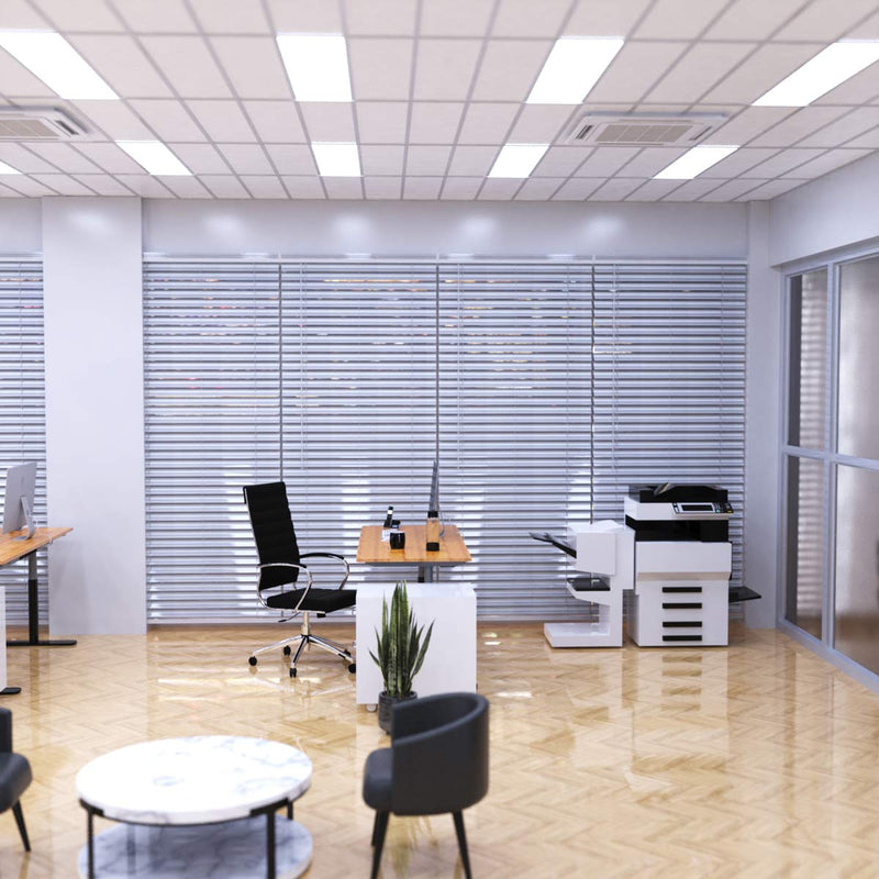 Simple Lighting - PAN 1230 LED Panel Light - Cool white LED panels illuminating an office floor with desks and copy machines.