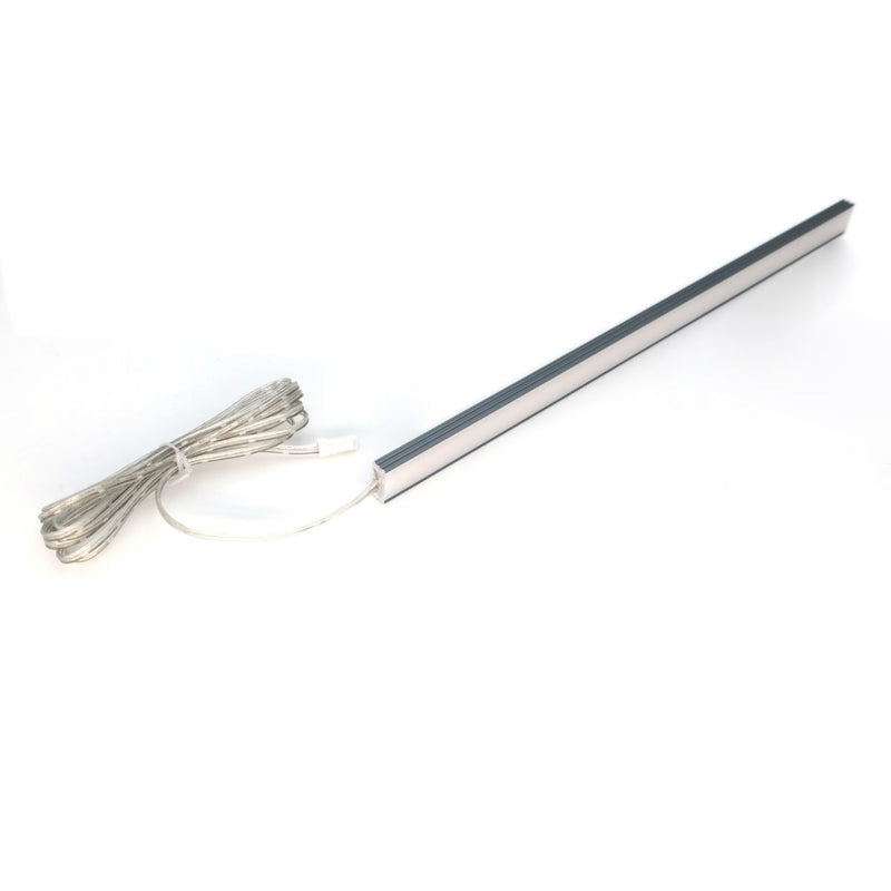 Simple Lighting - Lighteez 2m Surface LED Profile - A wide LED profile laid on its side with a cable attached to one end.