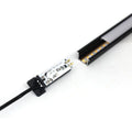 Simple Lighting - Lighteez 2m Input Cable With Sensor (PIR) - A close up of the electronics at the back of the PIR sensor, with the end of the profile in the background.