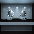 Black LED bathroom mirror above sinks setting in cool white light