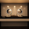 Black LED bathroom mirror above sinks setting in warm white light