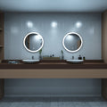 Rose gold LED bathroom mirror above sinks setting in cool white light