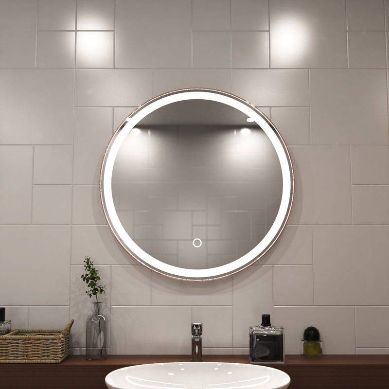 Rose gold LED bathroom mirror close up shot above sink setting in natural white light