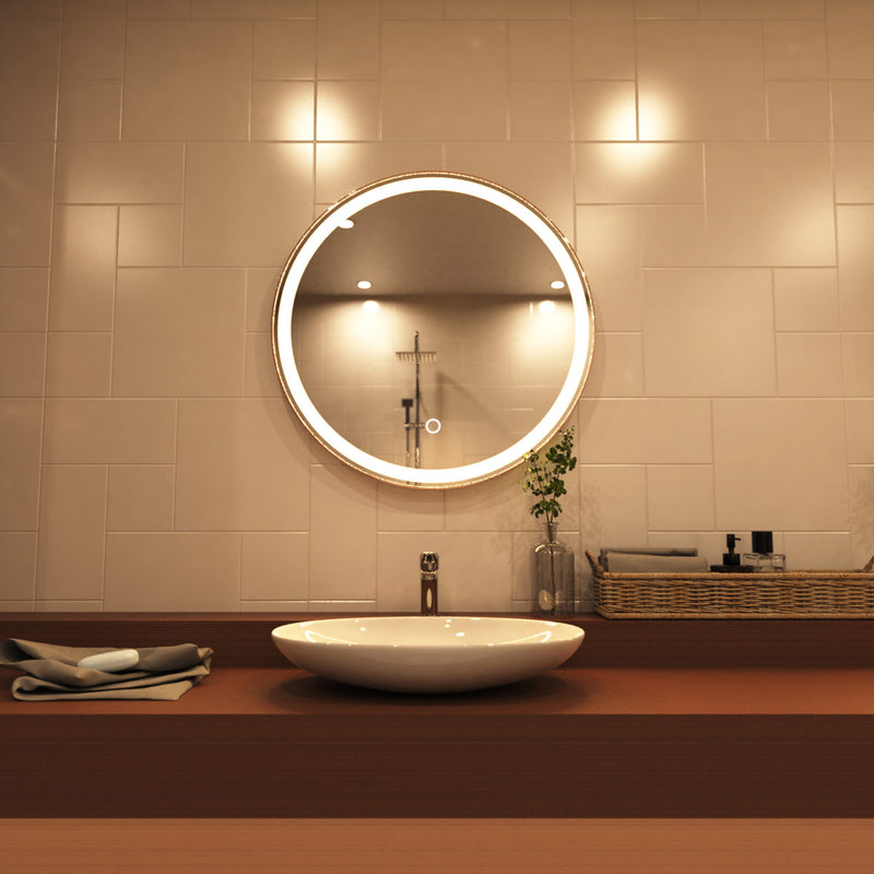 Rose gold LED bathroom mirror above sink setting in warm white light