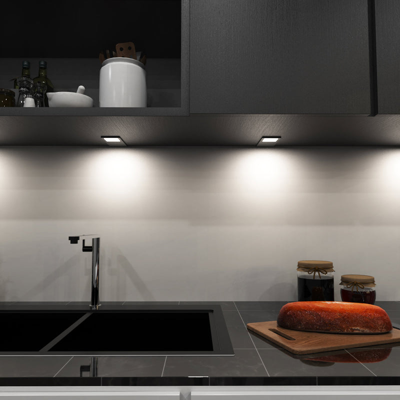 mid-shot of a kitchen with mounted LED black CCT cabinet lights - natural white light