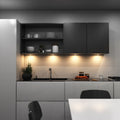 kitchen with mounted black LED CCT cabinet lights - warm white light