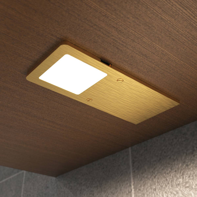installed brushed brass under cabinet light - natural white