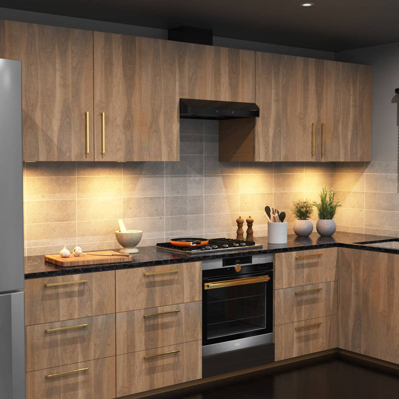 A full kitchen with wooden cabinets and a worktop illuminated by warm white slim under-cabinet lights.